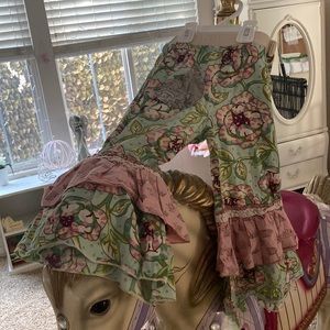 Adorable Mustard pie Capri pants with multi layered bell bottoms.